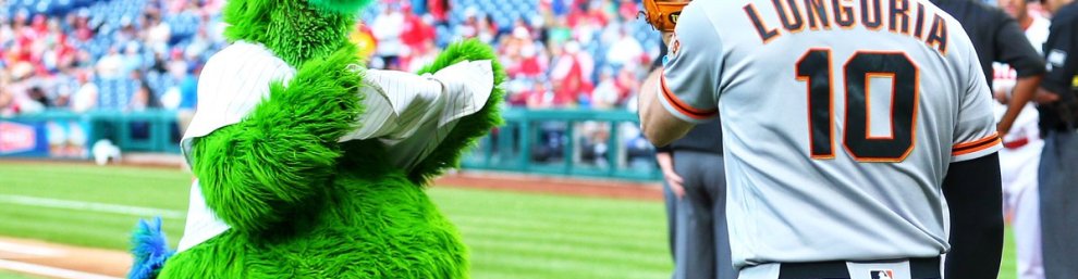 Evan Longoria of the San Francisco Giants with the Phillie Phanatic